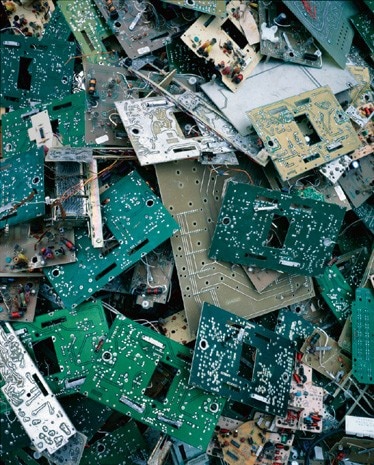 Photographs by the Chinese photographer Danwen Xing depict vast dumps of American ‘e-waste’, or computer rubble, shipped to Guangdong Province on China's south coast (the same province said to be the source of the SARS virus)
