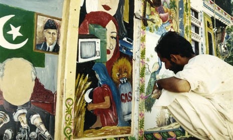 Karachi, artist decorating some panels 