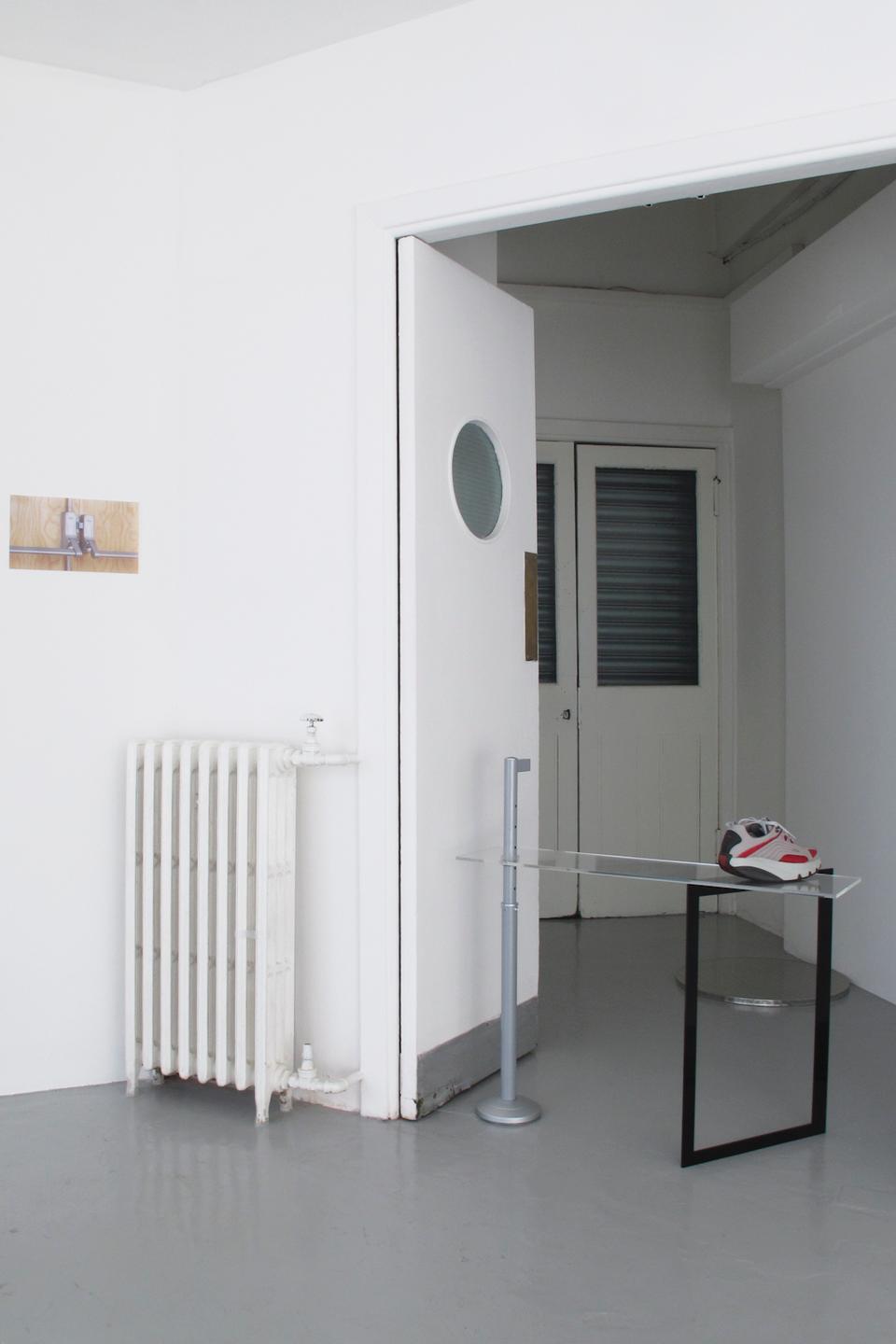 In the foreground, Marte Eknæs <i>Bollard,</i> 2011; behind the wall, <i>Panic Bar,</i> 2011; on the right, <i>Enhancement,</i> 2011.