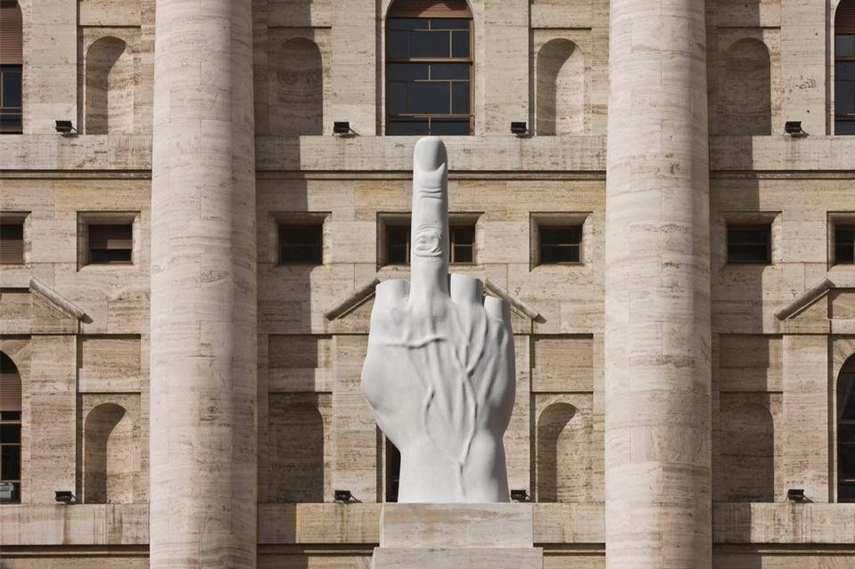 <i>L.O.V.E.,</i> the much- debated work by Maurizio Cattelan made of Carrara marble, installed in Piazza Affari, Milan, 2010. 