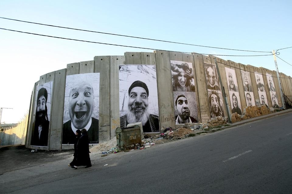 Artist JR's Face2Face project at the Separation wall between Israel and Palestine