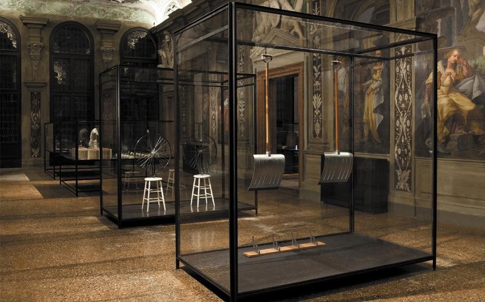 Top: <em>The Small Utopia. Ars Multiplicata</em>, installation view with works by Man Ray, Meret Oppenheim, Maurice Henry, Max Ernst, at the Prada Foundation, Venice. Above: works by Marcel Duchamp