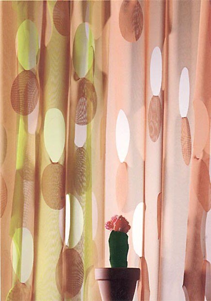 Lola by Création Baumann gets its special look from lasered-out circular segments