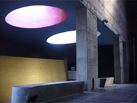 Sunlight enters the church through a series of skylights in primary colours