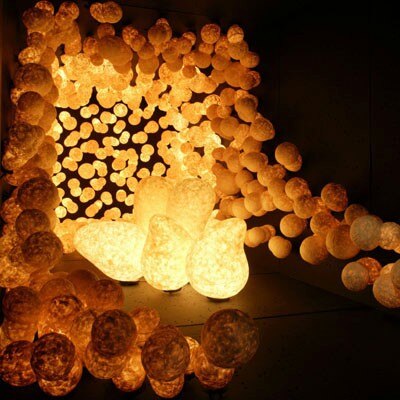 Pupils of the Chiyoda Ward elementary school, guided by Eriko Horiki, turn container 38 into a fantasy cavern lit by 400 deconstructed glowing cocoons made in Washi paper