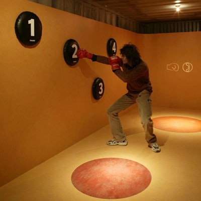 In order to stay in shape while communicating, Dutchman Wouter Roetering / Open Top constructed an extra-large telephone booth in container 65, with buttons that are punched with boxing gloves