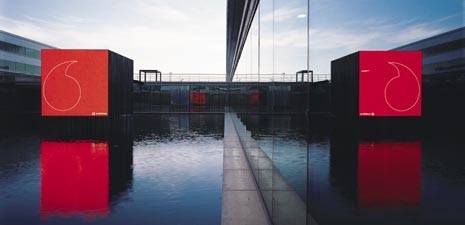 A huge outdoor display in the Vodafone headquarters in Lisbon presents lots of different changing multimedia screens. One is a football game you play by using your mobile phone