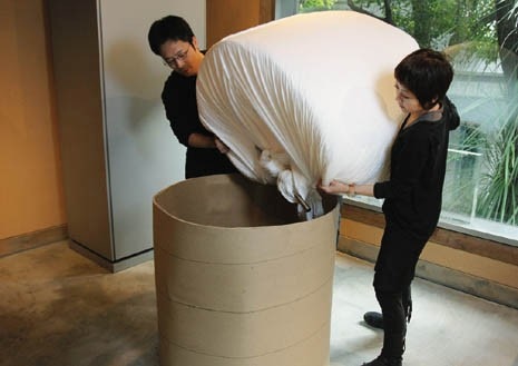 Stages in preparing the material for oven baking, which will give the chair its final shape