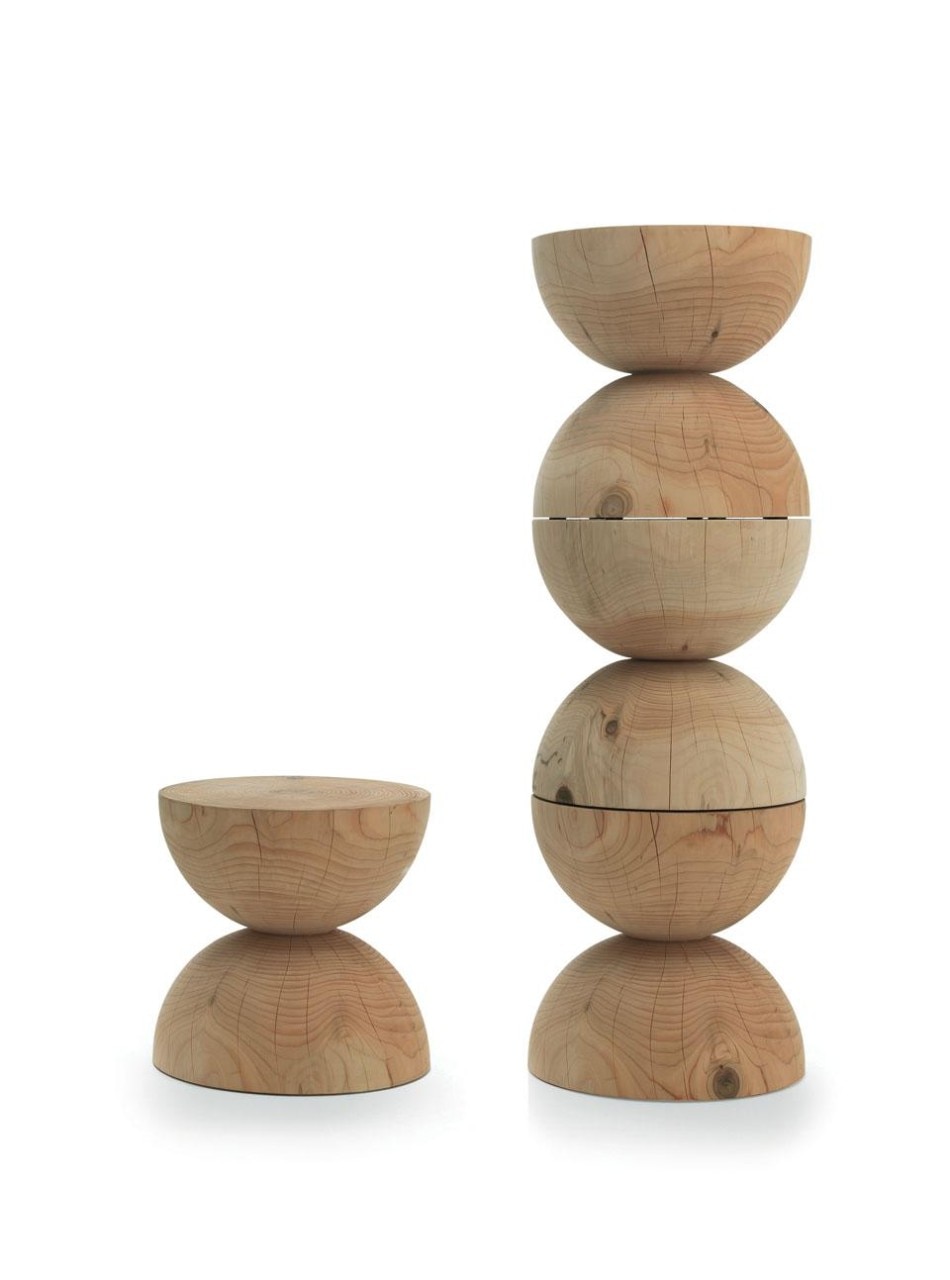 Clessidra stool, designed by Mario Botta. Modelled from a single block of fragrant cedar wood, the stool has a pin that allows the pieces to be stacked to form a column.