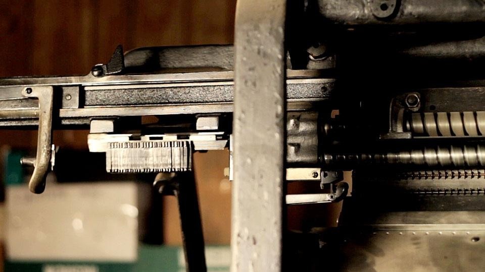 Tiny brass matrices being returned to the distribution bar on a Linotype Tiny brass matrices being returned to the distribution bar on a Linotype