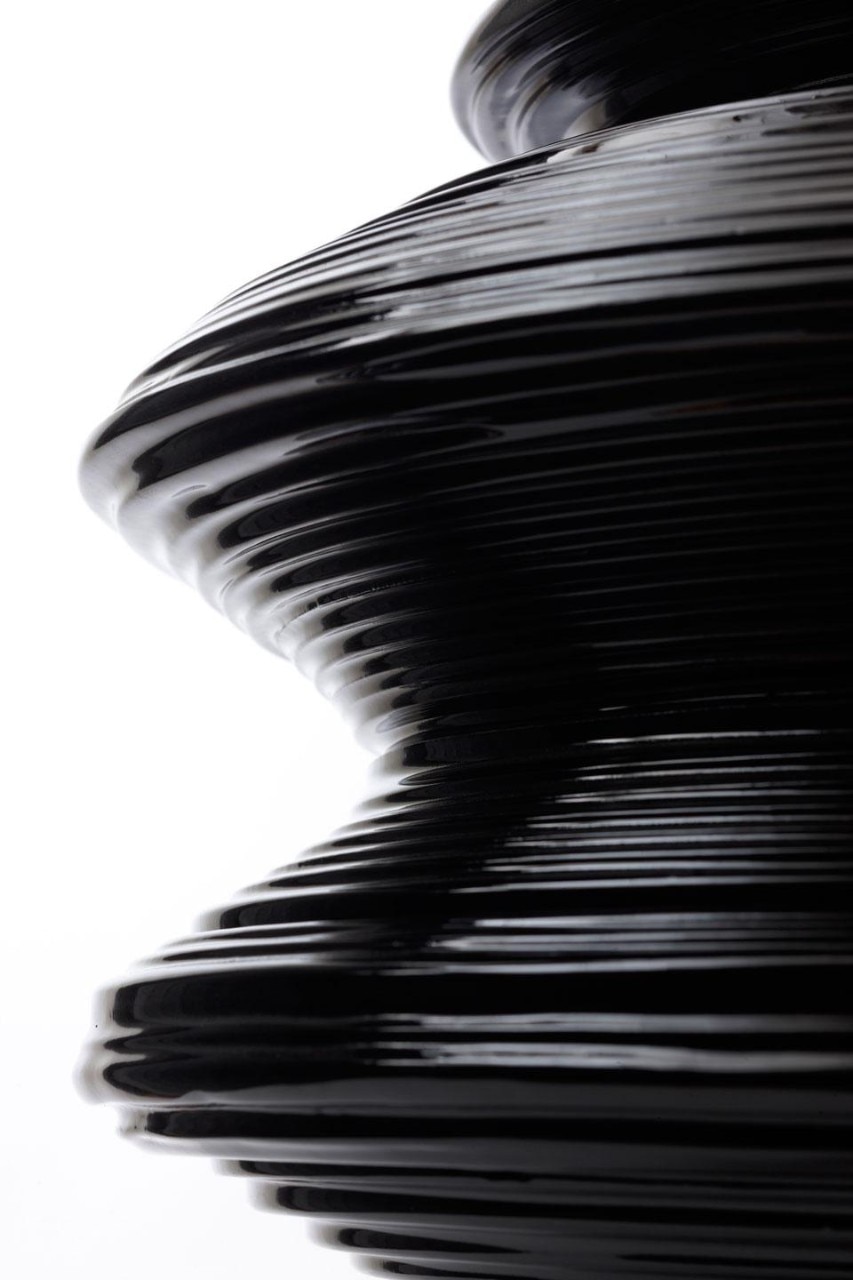 Mathieu Lehanneur, <em>L’Âge du Monde</em>, Issey Miyake Europe, 2009. . Glossy  
black enamelled ceramic.  
Manufacturer: Claude  
Aiello, Vallauris. Creative  
team: Julien Benayoun.  
The sculptures are a threedimensional visualisation  
of the population pyramids  
of different countries. Birth  
is represented at the base,  
death at the apex. The  
cross-sections of the vase  
contour change in relation  
to the age rings reproducing  
life expectancy. There are  
100 strata from the base to  
the top.
Courtesy of Perimeter Art&Design. Photo by Alexandre Balhaiche

