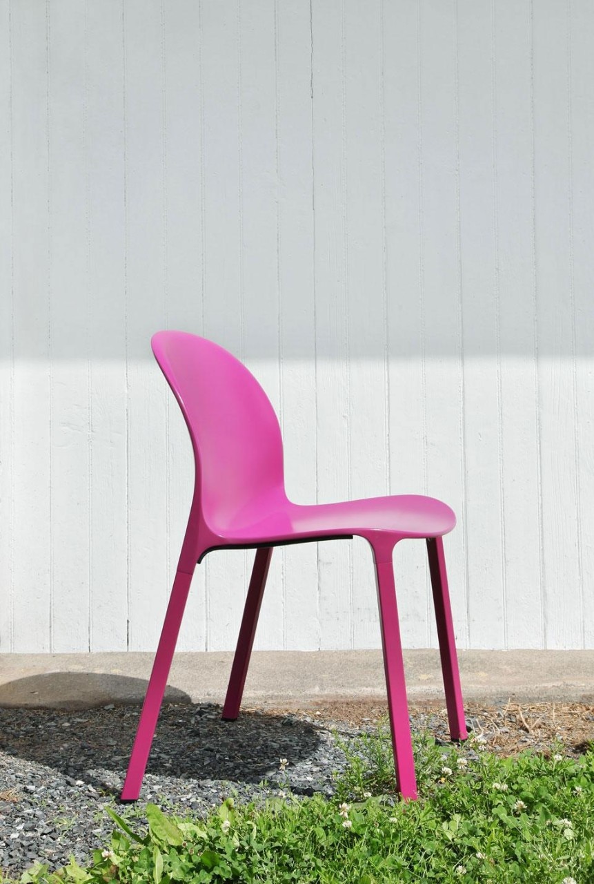 The stackable chair is made with a thin, die-cast aluminium seat shell, extruded aluminium legs and plastic connectors