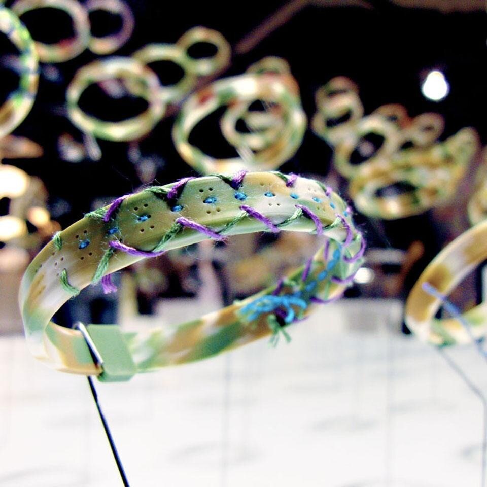 A-Study and 1Pac.Inc's <em>Id-Band</em>, a silicone bracelet with small perforations, allowing for customisation