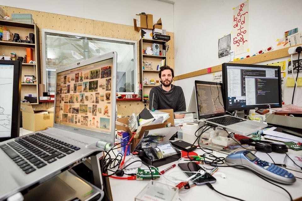 Jack Schulze surrounded
by materials used in the
product development phase