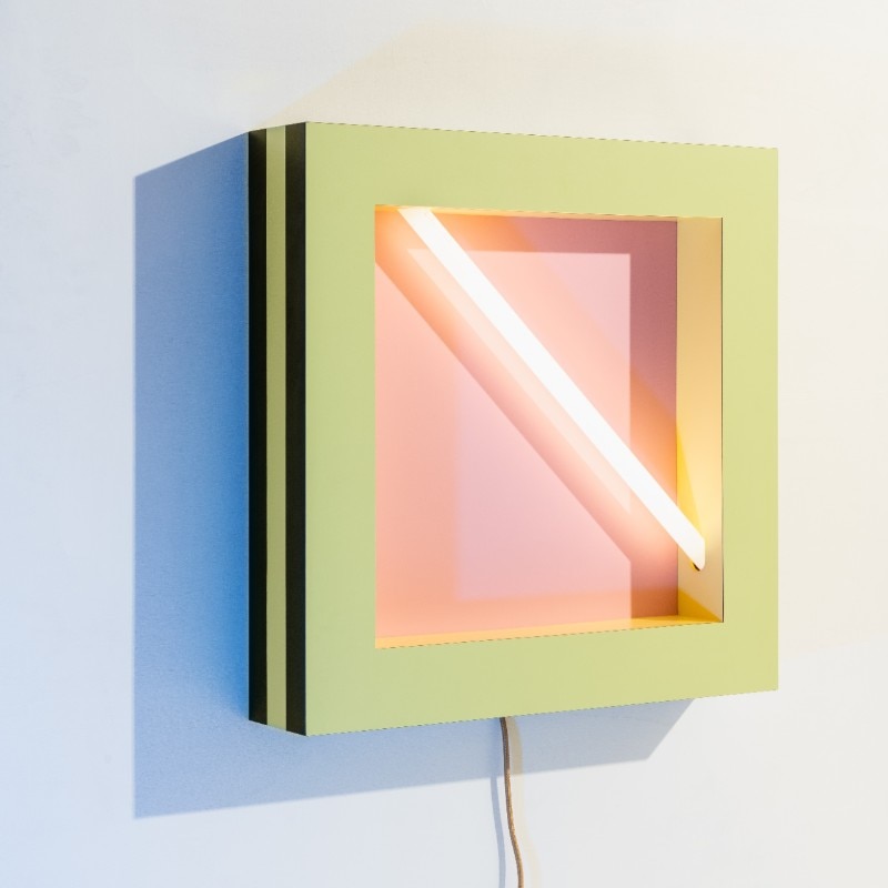 Negresco, Martine Bedin, Memphis-Milano, 1981, Wall lamp in wood and plastic laminate with alternating layers of colour, and with a neon light embedded within the frame, W 60, D 12, H 60 cm. Photo © Delfino Sisto Legnani (@dsl__studio). Courtesy Memphis srl
