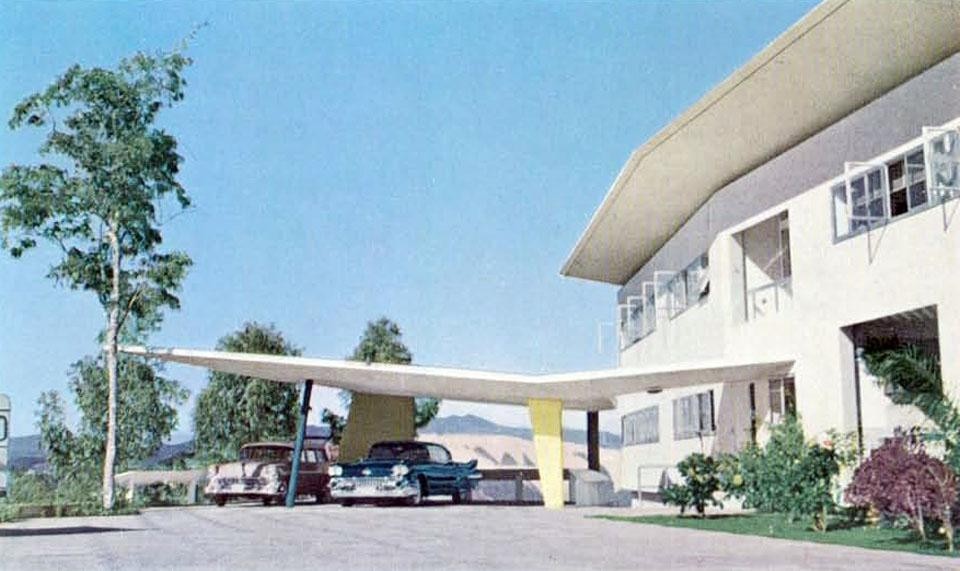 The appearance of the entry. A wing with its large cantilever shades the outdoor car park The appearance of the entry. A wing with its large cantilever shades the outdoor car park