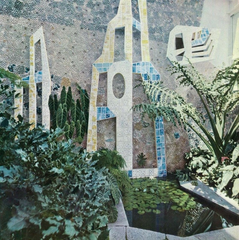 The patio from the living room window. The patio walls are faced with a background 'texture' in elements of walled tiles. In front of them, detached from the wall, are thin ceramic shapes of different designs (a kind of fantastic abstract climbing vegetation). The ceramics are by Fausto Melotti
