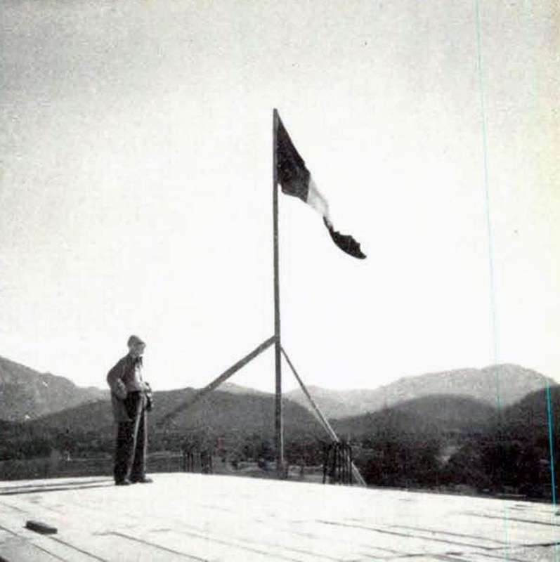 Le Corbusier and the flag raised above the "Unité d'habitation," October 6, 1949. Le Corbusier and the flag raised above the "Unité d'habitation," October 6, 1949.