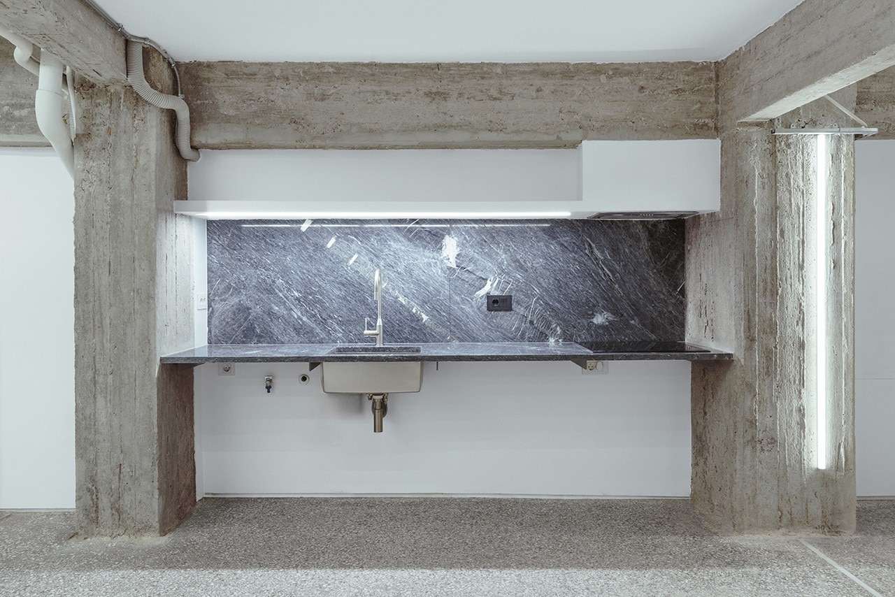 A former brutalist textile workshop becomes a house-studio in Athens