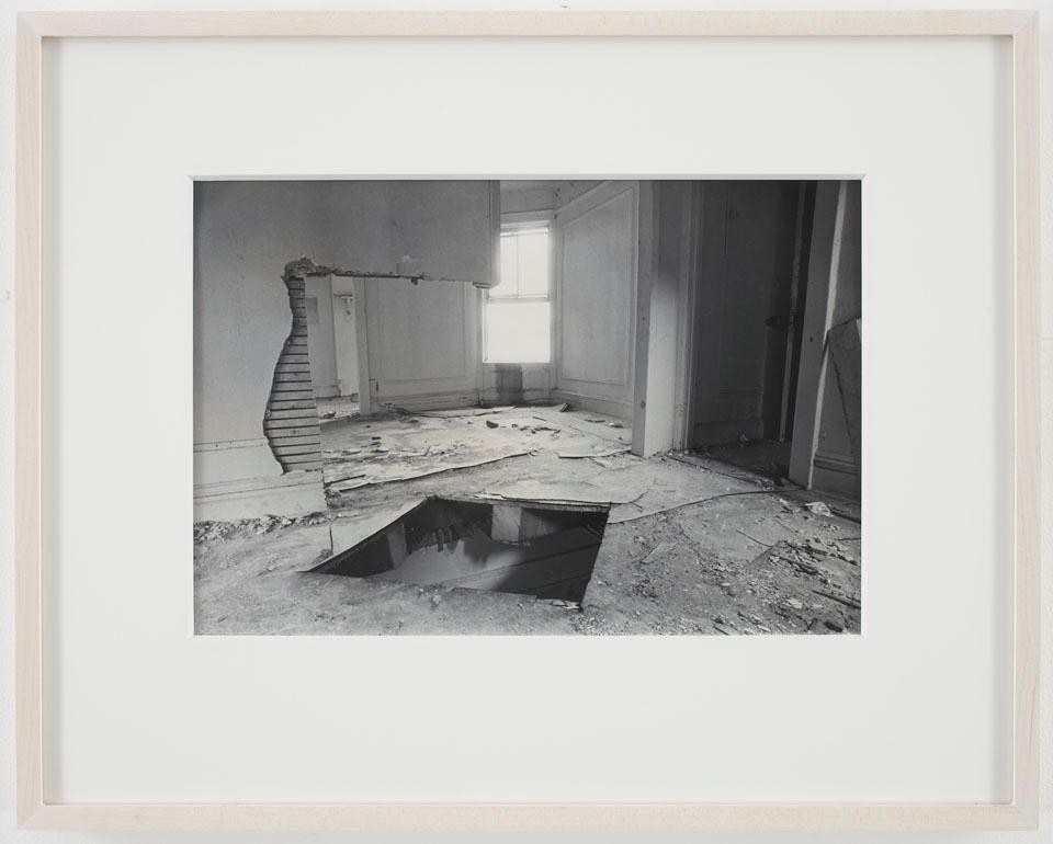 Gordon Matta-Clark<br>
<i>Bronx Floor: Floor Hole</i>, 1972.
Gelatin silver print, 41.3 x 51.4 x 3.8 cm. Courtesy David Zwirner, New York
