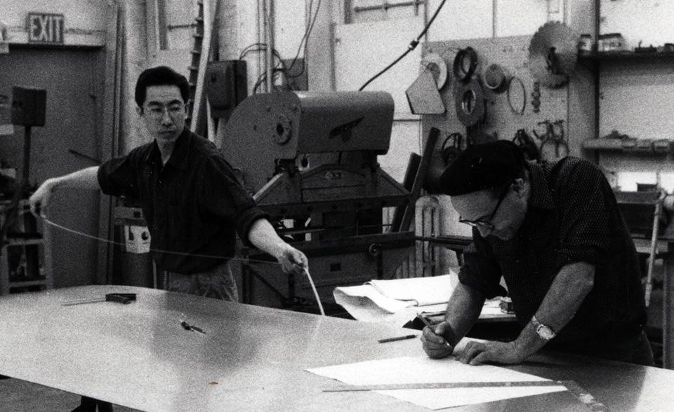 Top: Edison Price, Shoji Sadao, and Buckminster Fuller with parts for MoMA Tensegrity mast, 1959. Courtesy of Fuller and Sadao PC. <br />Above: Isamu Noguchi and Shoji Sadao working on aluminum sculptures at Edison Price’s shop, 1958. Photo Courtesy The Noguchi Museum, New York. Top: Edison Price, Shoji Sadao, and Buckminster Fuller with parts for MoMA Tensegrity mast, 1959. Courtesy of Fuller and Sadao PC. <br />Above: Isamu Noguchi and Shoji Sadao working on aluminum sculptures at Edison Price’s shop, 1958. Photo Courtesy The Noguchi Museum, New York.