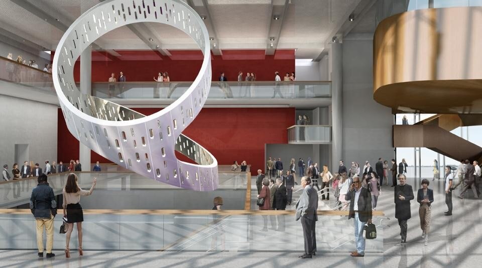 The 3-tonne structure is suspended at one end, allowing it to hang at its angle of equilibrium. Together with the cut-outs in the cylindrical form, this angle minimizes the installation's weight, while refracting natural daylight into the atrium.