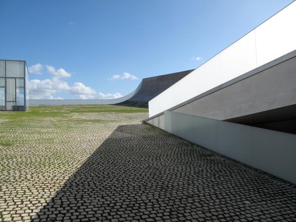 Portuguese cobblestones allow for the growth of grass and natural vegetation. Photo Steven Holl