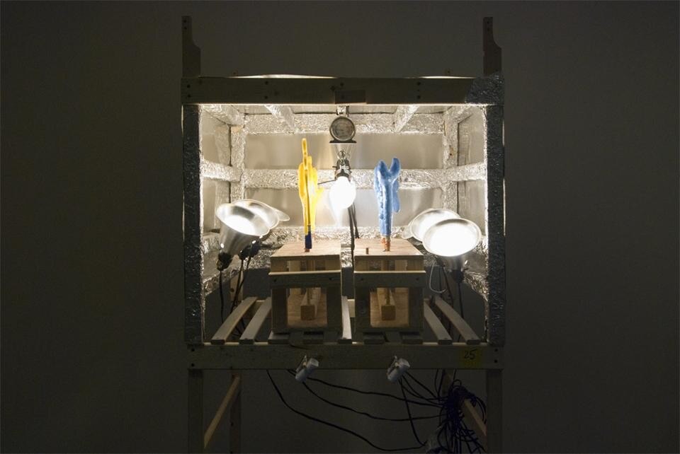 The oven is made from light bulbs, aluminum foil and an IKEA futon frame.
