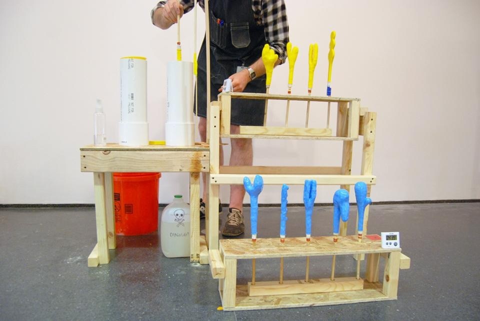 Above: balloon molds are dipped in latex. Opening photo: 40 balloon molds pass through the production line several times each day. Formal characteristics must be exaggerated in the hand-sculpted molds to remain legible in the inflated shape.