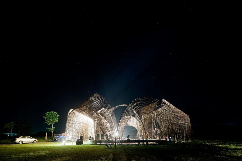 Forest Pavilion as an illuminated beacon by night in the Eco-park