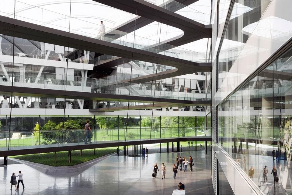 Lined up in a circular
arrangement, the office areas with their large glazed surfaces open onto the atmospheric inner
space and the remarkable landscaped space. Lined up in a circular
arrangement, the office areas with their large glazed surfaces open onto the atmospheric inner
space and the remarkable landscaped space.