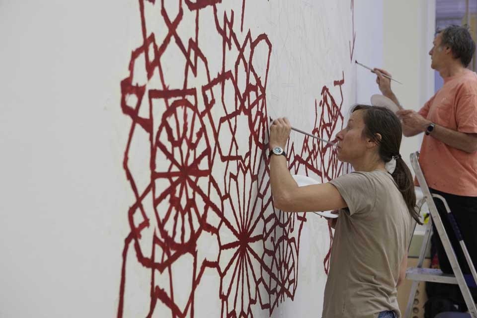 Michael Brennand Wood (UK) will create a new work for the <i>Lost in Lace</i> exhibition.
The work will consist of a number of aluminium roundels that
incorporate military symbols such as planes, bombs and artillery. These
roundels, coloured red and black, will be fixed on to the wall and connected
using threads to create a constellation-like lace pattern