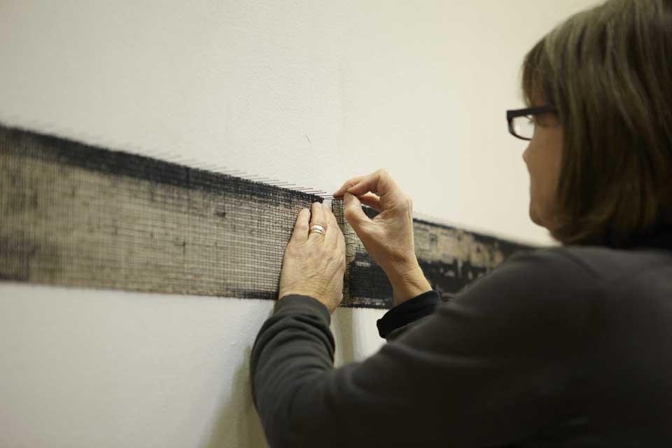 Diana Harrison (UK) will present a six metre-length of cloth with each metre
representing a decade of her life. Harrison will burn, print and stitch the cloth
to expose the underlying structure and display it slightly proud of the gallery
wall to cast a pattern of shadows