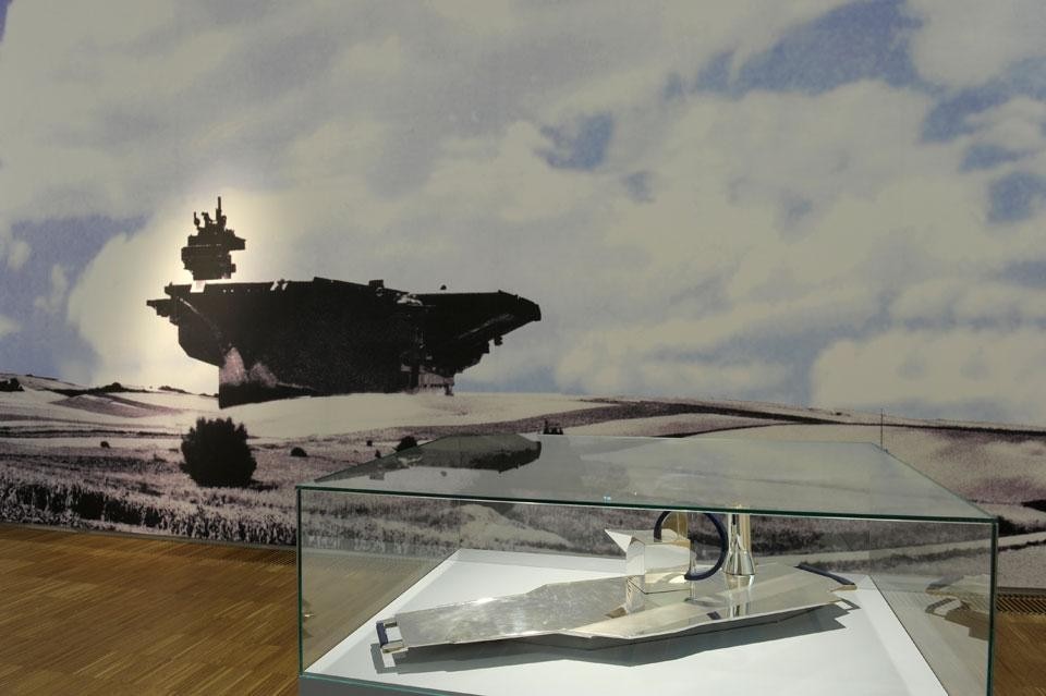 Top: <em>Das Goldene Kalb</em>. Photo by N. Lackner. Above: <em>The Universal Artist Hans Hollein</em>, installation view. Photo by UMJ/N.Lackner