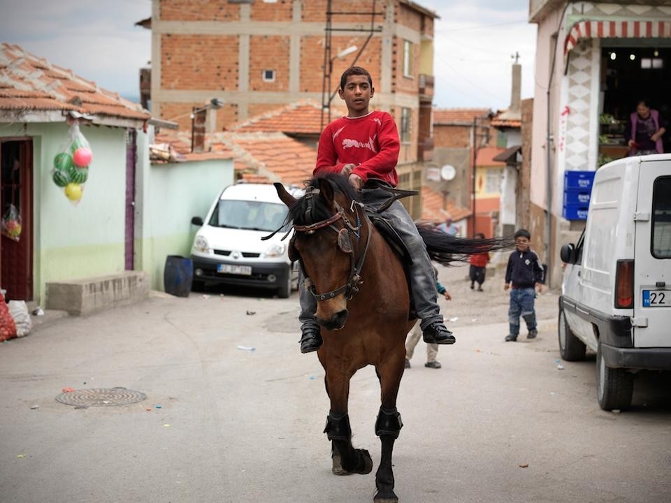 Sitki Kosemen, <em>Boy Riding</em>. From the series <em>Edirne - Roma Kakava Festivities</em>, 2011