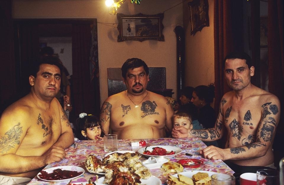 Top: Danica Dakic, <em>La Grand Galerie 1</em>, 2004. Above: Nigel Dickinson, <em>David, his brother and brother in law, at the dinner table for Orthodox Catholic Christmas meal</em>, Belgrade, Serbia. 7 January 2004