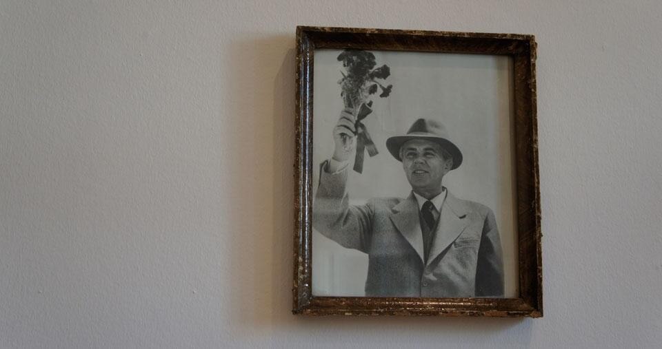 Top: A film still of the <em>Concrete Mushrooms Documentary</em>, on display at <em>Concrete in Common</em>, Kunst Raum Riehen, Basel. Above: A portrait of Albanian dictator Enver Hoxha. Photos by Xheni Alushi