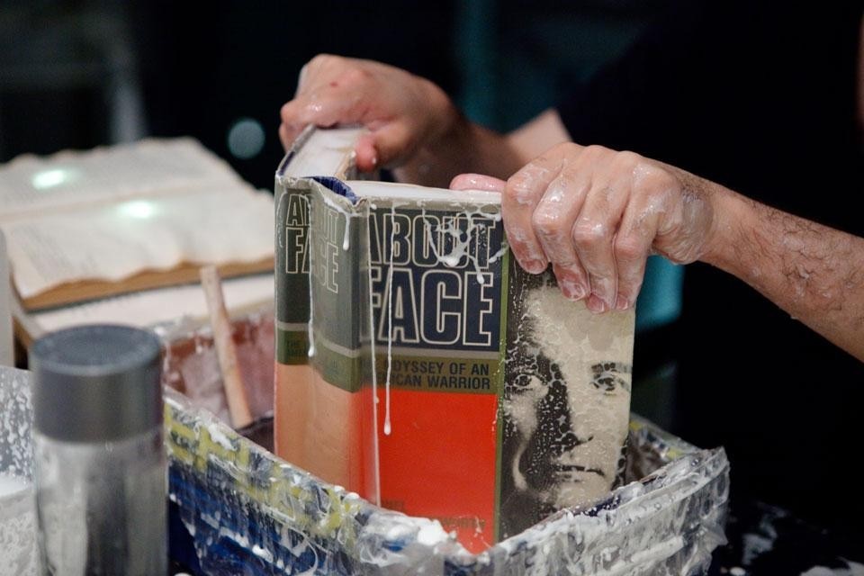 Top: performance organized by Tony Yap and Yumi Umiumare. Above: one of the 10,000 books being prepared for the installation <i>Literature v/s Traffic</i>, Luzinterruptus, part of the <i>Light in winter</i> festival, Melbourne