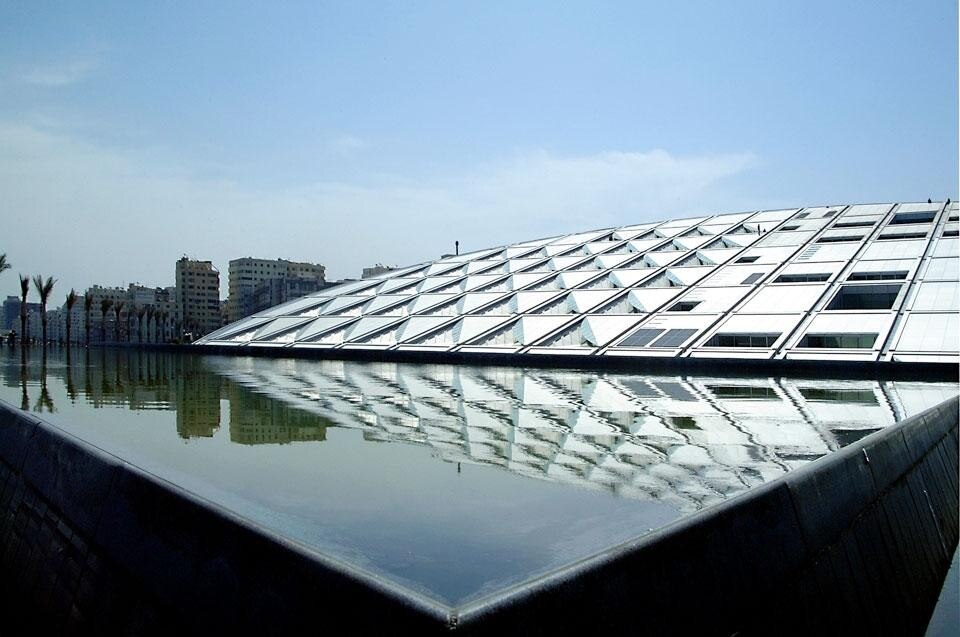 Top: Herzog & de Meuron and TFP Farrells, de Young Museum, Golden Gate Park, San Francisco, California, USA, 1999-2005. Photo by Erica Overmeer. Above: Snøhetta, Alexandria Library, Alexandria, Egypt, completed 2001