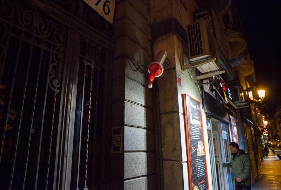 Top: The Werkbundsiedlung on its opening day, 4 June 1932. Photo by Albert Hilscher. © Austrian National Library, Image archive and graphics collection. Above: Luzinterruptus, <em>Merry Christmas to those who watch us</em> installation, Madrid 2012