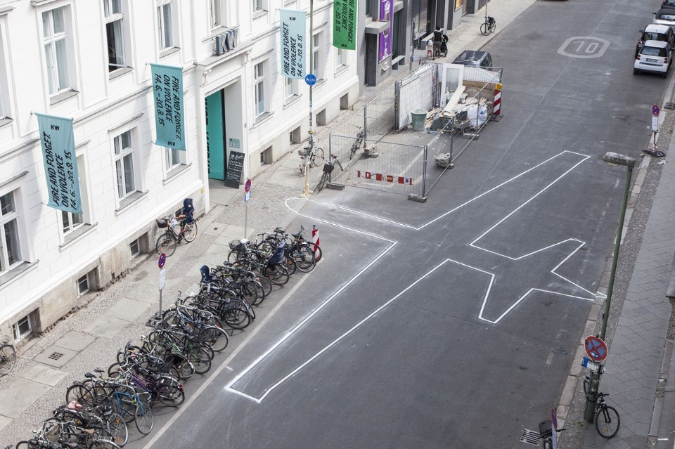 James Bridle, <i> Drone shadow</i>, ongoing project. Road-marking paint, realization following a drone shadow. Installation view. Photo Timo Ohler James Bridle, <i> Drone shadow</i>, ongoing project. Road-marking paint, realization following a drone shadow. Installation view. Photo Timo Ohler