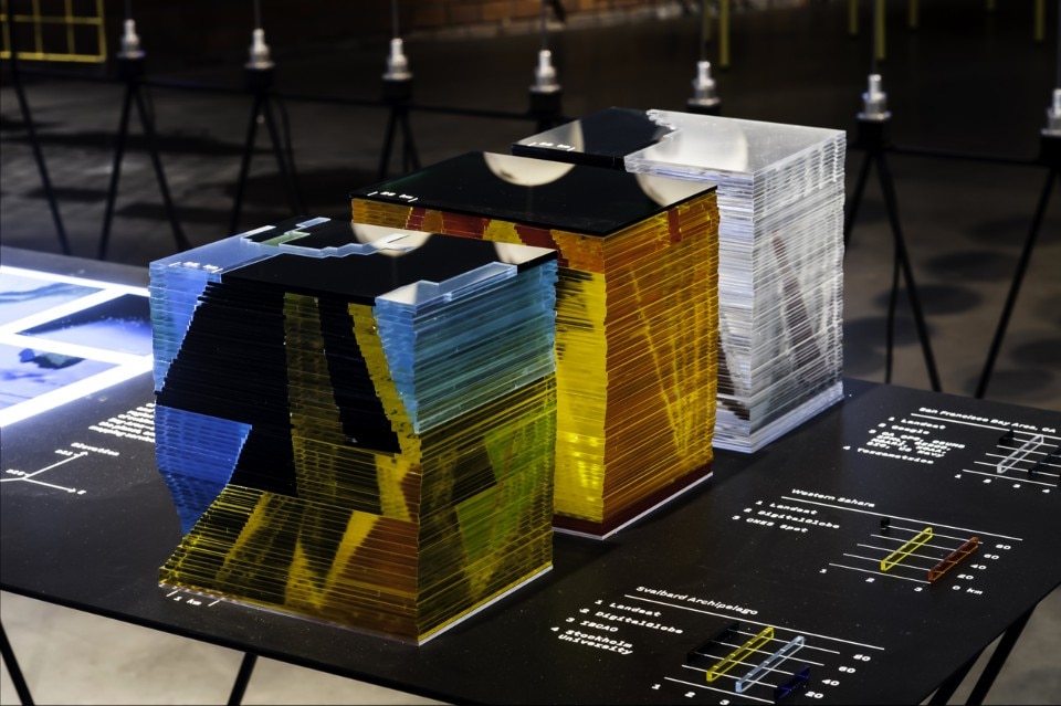 Folder, Uncharted—Footnotes to the Atlas, installation view, On Residence, Oslo Architecture Triennale 2016: After Belonging. Detail of the section “The Digital Earth: Charting the Z-axis”: three models represent a vertical section through the cloudless, evenly-lit skies of digital mapping services, showing the variety of sources of the current global remote sensing apparatus. Photo © Folder