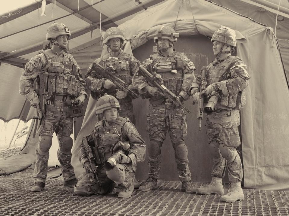 Simon Norfolk, <i>Some of the Media Operations team including a Combat Camera unit , Camp Bastion, Helmand,</i> 2010–11, from <i>Burke + Norfolk.</i> Simon Norfolk, <i>Some of the Media Operations team including a Combat Camera unit , Camp Bastion, Helmand,</i> 2010–11, from <i>Burke + Norfolk.</i>