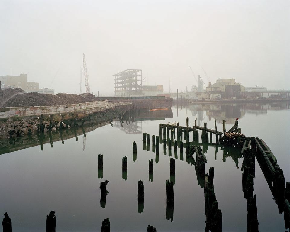 Pier remains from the Long Island Rail Road swing bridge, Blissville, Queens, looking southwest. From <i>Newtown Creek: A Photographic Survey of New York's Industrial Waterway </i>by Anthony Hamboussi - Princeton Architectural Press, 2010 