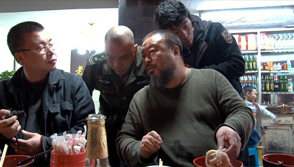 Dining with a friend in a restaurant in Chengdu, Weiwei is interrupted by local police