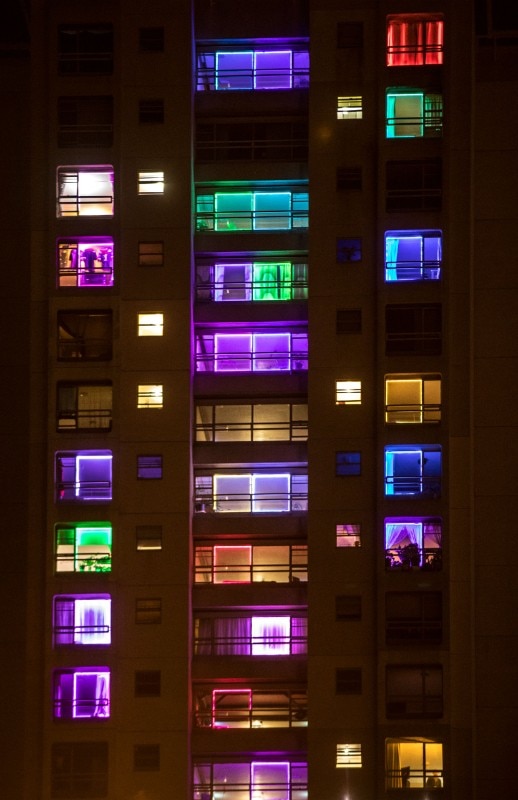 The Waterloo Towers illuminated by the project We Live Here