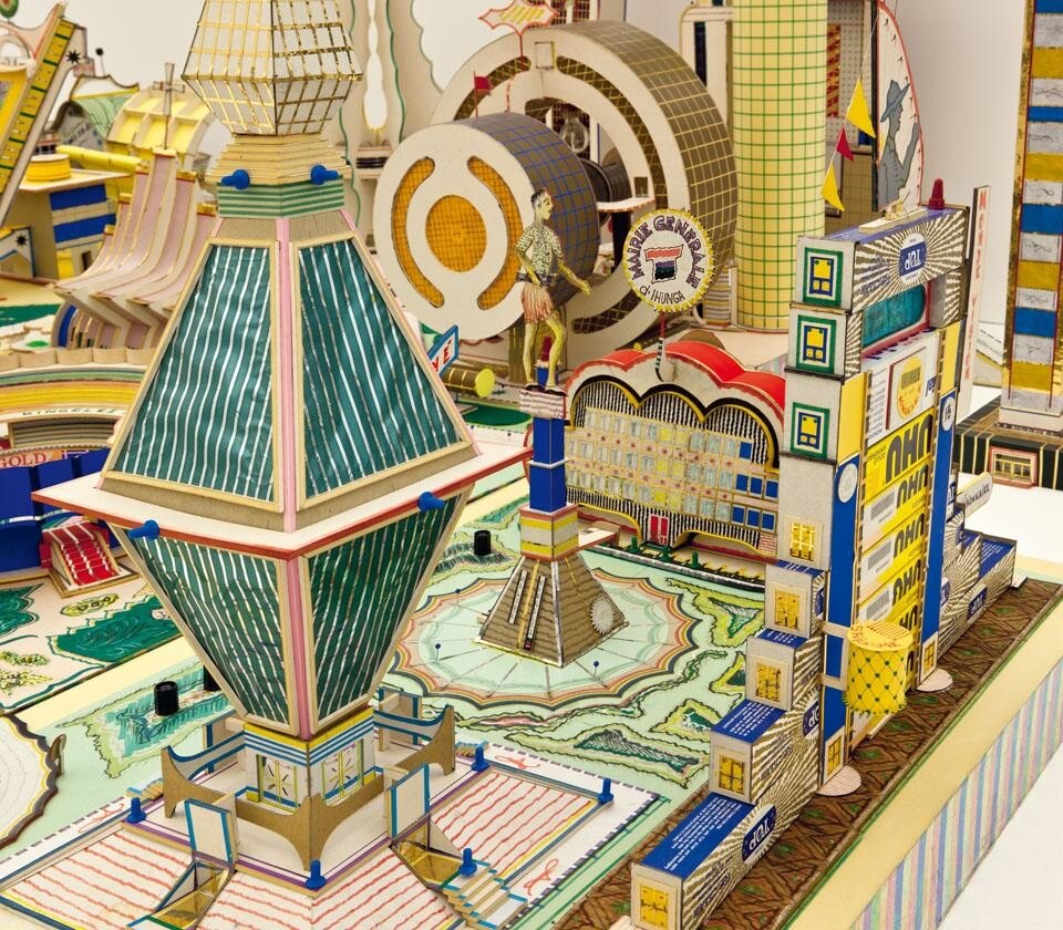 Qui sopra e in apertura: dettagli di <i>Kimbembele Ihunga</i>, 1994, del congolese Bodys Isek Kingelez, in mostra a Le Magasin di Grenoble in <i>Japan Congo</i>, la mostra sulla collezione Pigozzi curata da Carsten Höller.