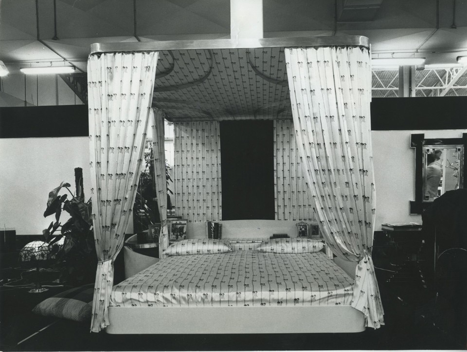 Canopied bed with components in briar and poplar with polished brass fittings, designed by Alain Delon, 1975. Courtesy of Salone del Mobile