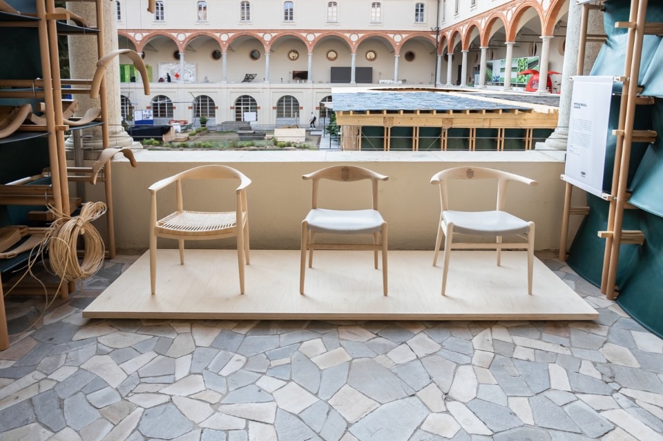 The School, Lendager Group. The exhibition set up in one of the cloisters’ colonnades with the Danish brands using the chairs as a display structure.