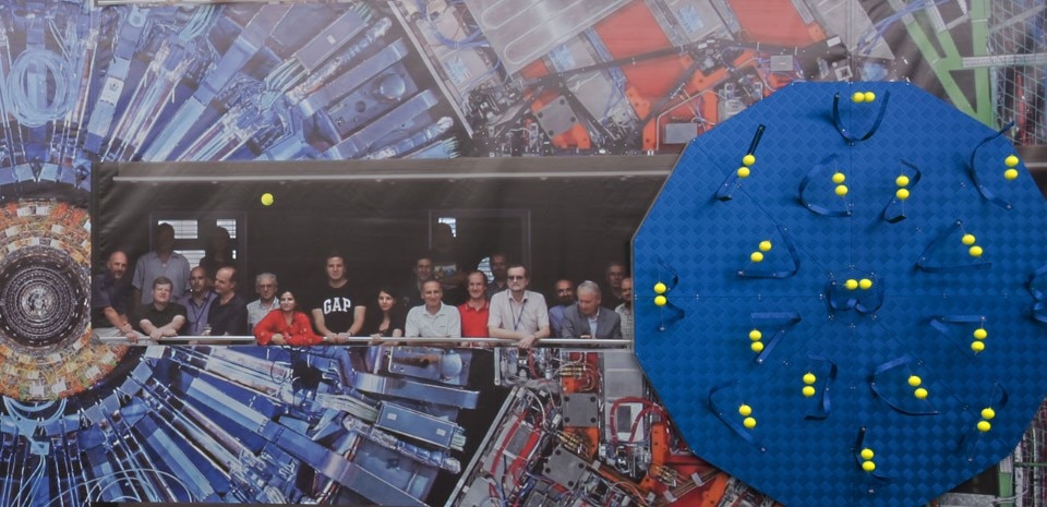 Luca Pozzi, <i>Detectors</i>, 2015. Exhibition view at Spazio 22, FL Gallery : Photo © Cosimo Filippini. Background image ©: CERN (LHC, Atlas Detector) and Michael Hoch (CMS Experiment)
